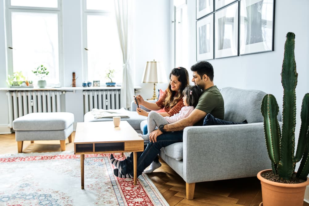 A family relaxing together in a bright living room